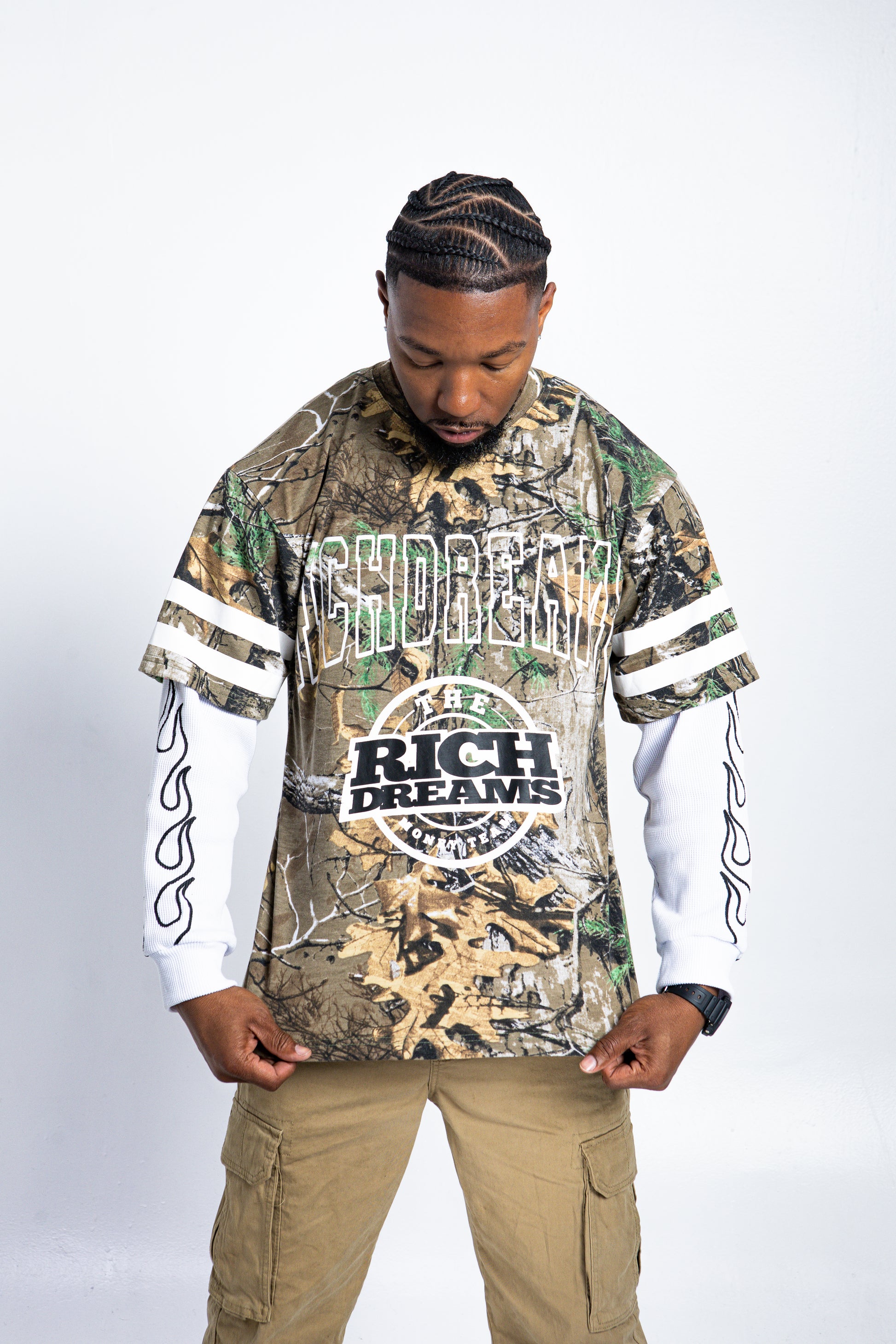 Model wearing Rich Dreams camo thermal long sleeve streetwear top
